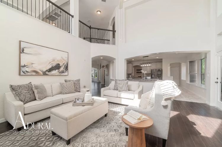 Staged living room using soft neutral color palette to attract home buyers